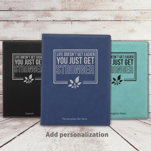 black, blue, and teal leather padfolios featuring Life Doesn't Get Easier message
