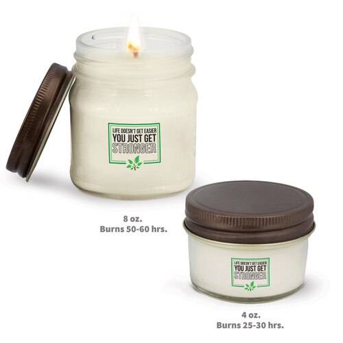 two white candle in glass jar with life doesn't get easier message