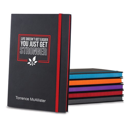 black matte journals in multiple accent colors with Life Doesn't Get Easier message and personalization