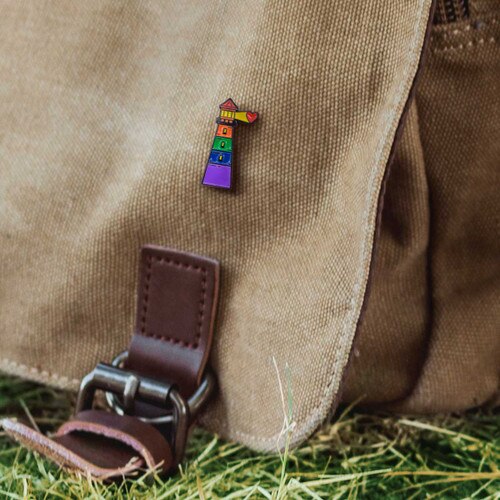 light house lapel pin on canvas bag