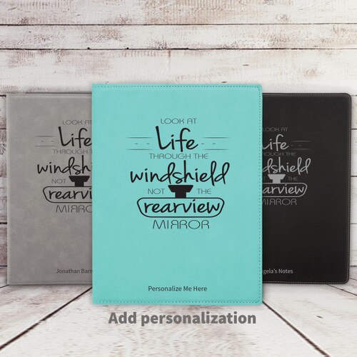 grey, blue, and black leather padfolios featuring Look At Life message