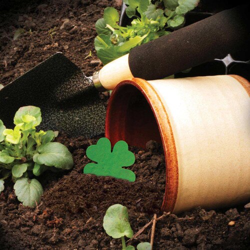 flower pot with dirt and shovel
