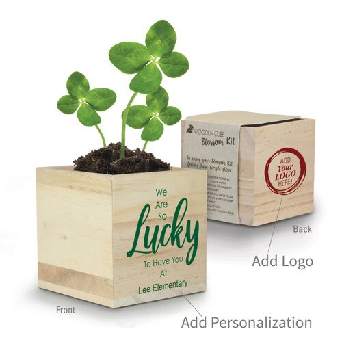 clover in a wooden cube with lucky message and add you logo