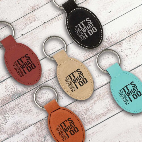 multiple colors of oval keychains with making a difference message