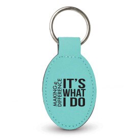 teal oval leather keychain with making a difference message