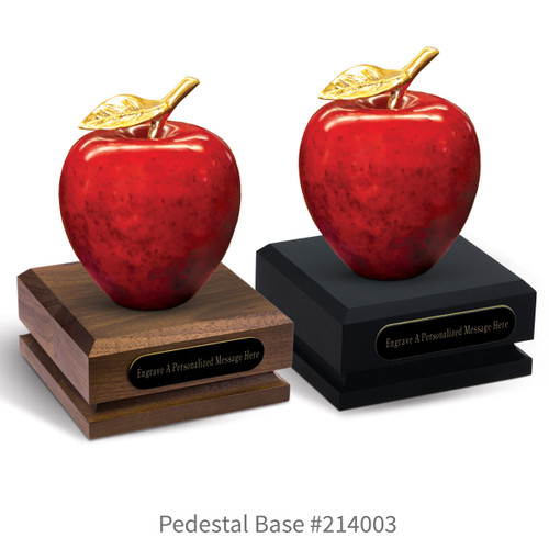 black and a brown walnut three-quarter round bases with black brass plates and natural stone apples