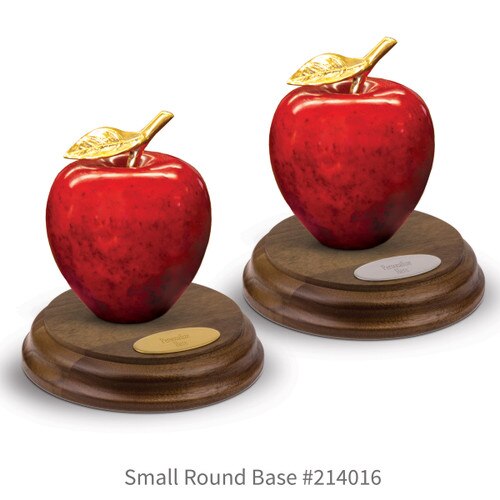 round walnut bases with brass and silver plates and natural stone apples