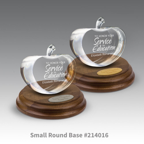 round walnut bases with brass and silver plates and center cut optic crystal apples with service to education messsage