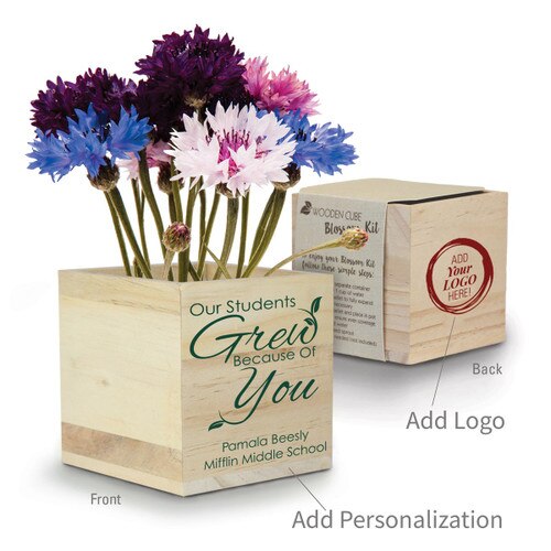 patriotic flowers in a wooden cube with our students grew message and add your logo