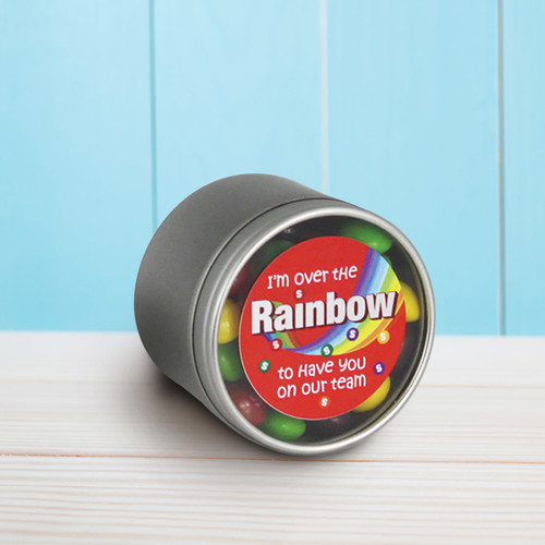 round tin with over the rainbow message and skittles