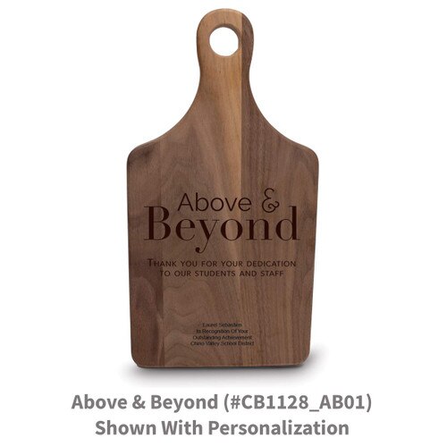 walnut paddle cutting board with above and beyond message