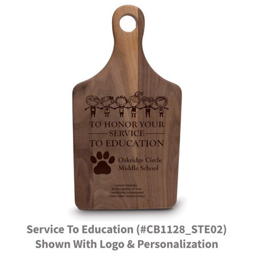 walnut paddle cutting board with service to education message