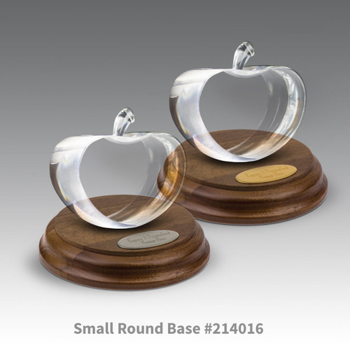 round walnut bases with brass and silver plates and center cut optic crystal apples