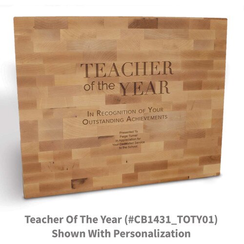 butcher block cutting board with teacher of the year message
