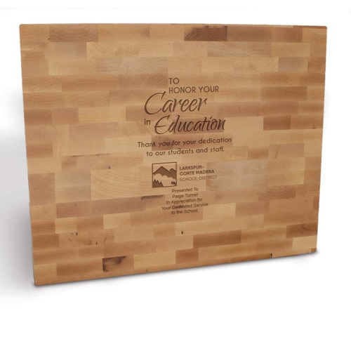 butcher block cutting board with career in education message