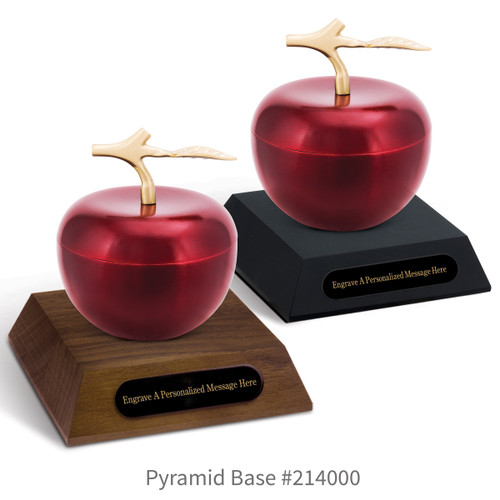 black and a brown walnut pyramid bases with black brass plates and crimson apple dishes