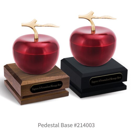 black and a brown walnut pedestal bases with black brass plates and crimson apple dishes