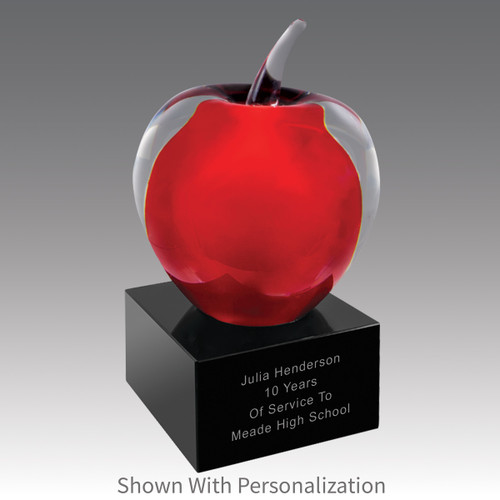 solid clear glass apple with red center on a black glass base with personalization