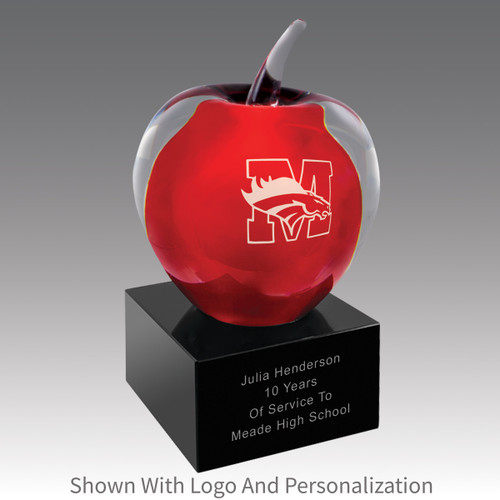 solid clear glass apple with red center on a black glass base with personalization and logo