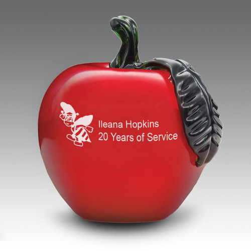Solid red crystal apple with green stem and leaf