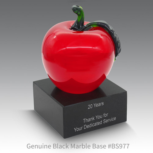 black marble base with red crystal apple