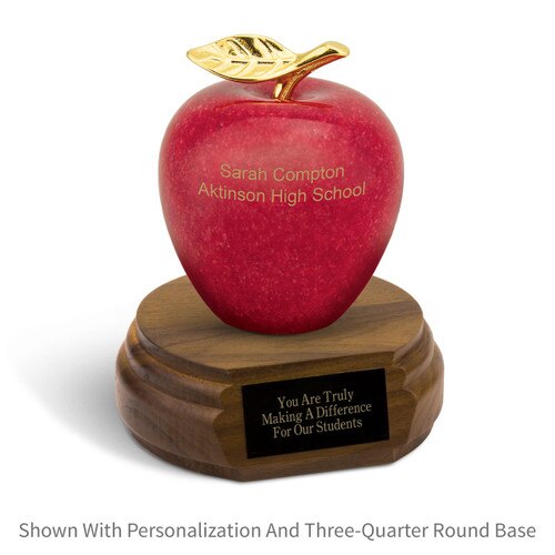 personalized marble apple sitting on top a walnut base with black brass plate