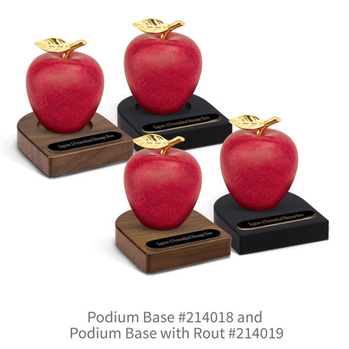 black and brown walnut podium bases with black brass plates and marble apples