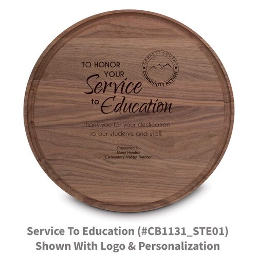 walnut round cutting board with service to education message