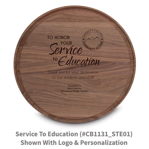 walnut round cutting board with service to education message