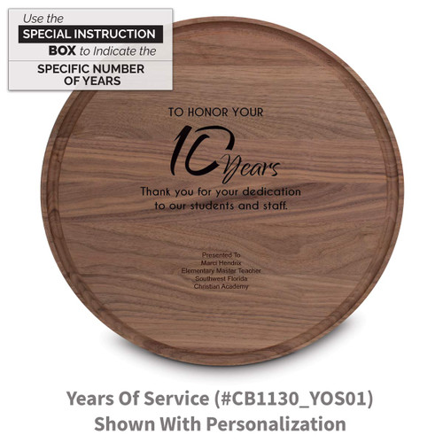 walnut round cutting board with years of service message