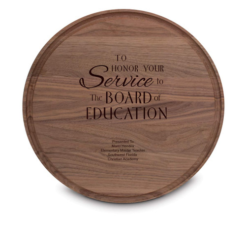 walnut round cutting board with service to the board message