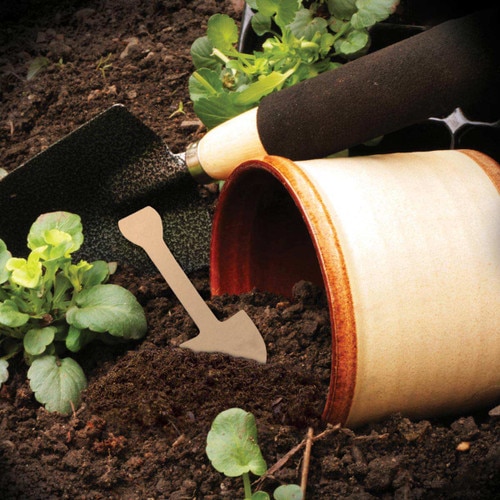 flower pot with dirt and shovel