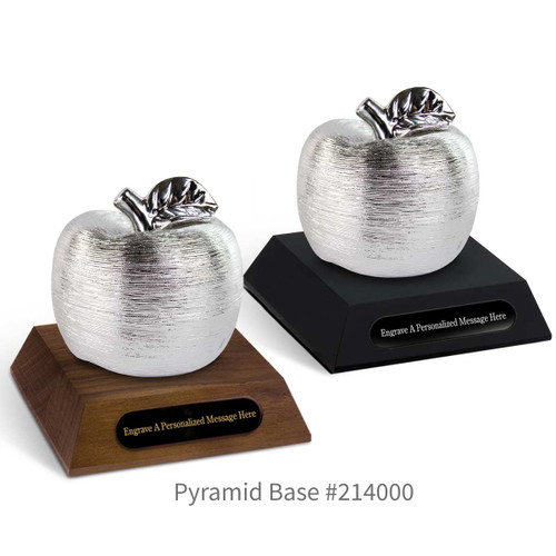 black and a brown walnut pyramid bases with black brass plates and silver spun apples