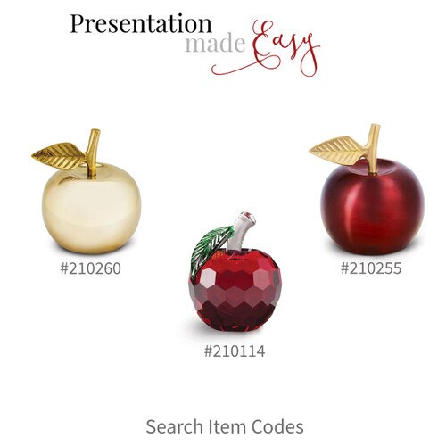 brass apple bell, crimson brass apple bell, and a faceted crystal apple