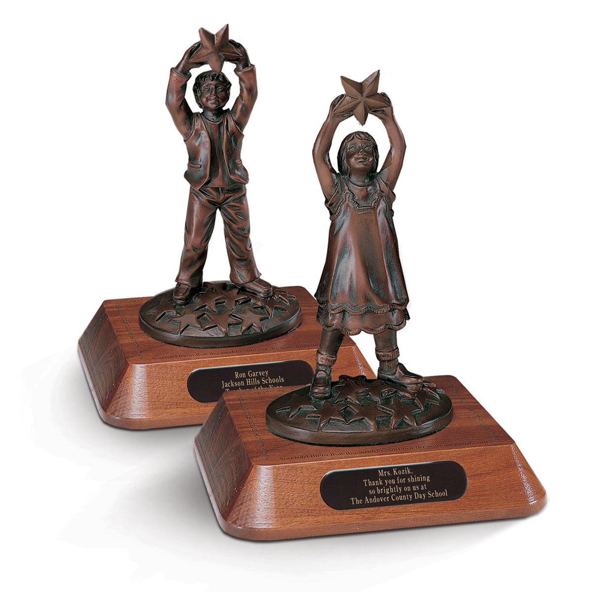 star polisher base awards with statues of a boy and a girl holding a star