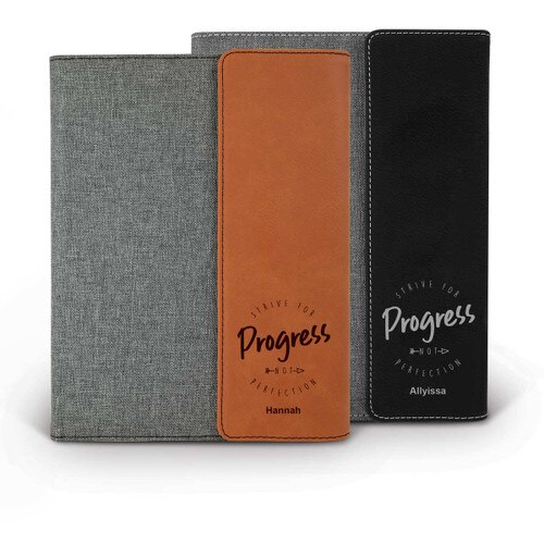 heather gray padfolios with black and rawhide accents featuring Strive For Progress message