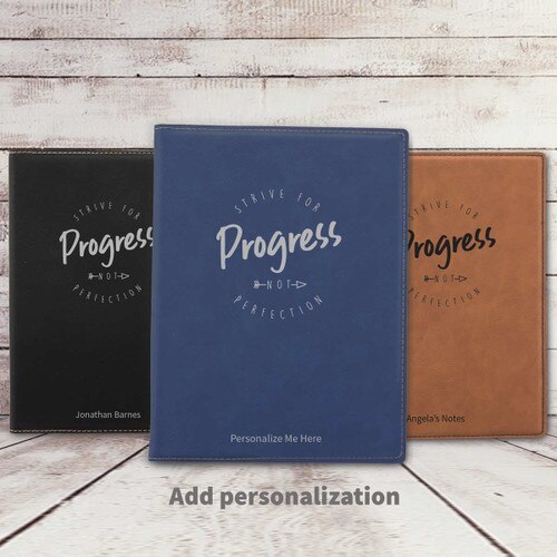 black, blue, and rawhide leather padfolios featuring Strive For Progress message