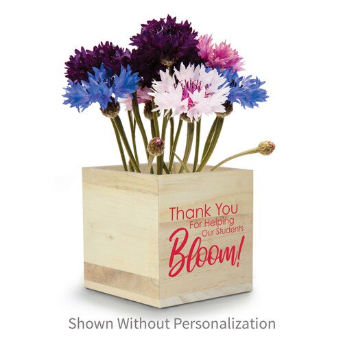 colorful flowers in a wooden cube with thank you message