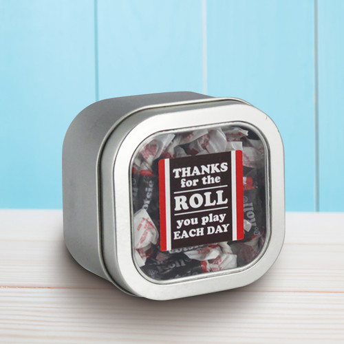 square tin with thanks for the roll message and individually wrapped tootsie rolls
