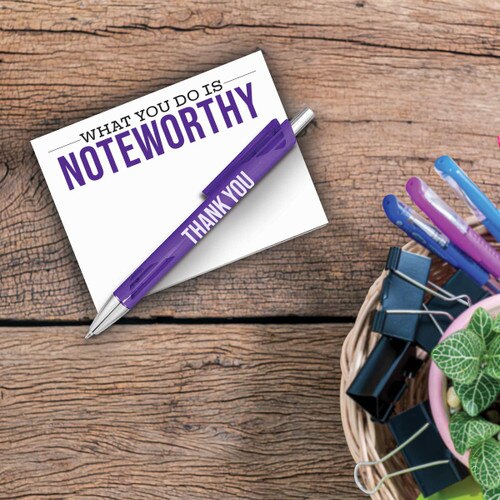 what you do is noteworthy notepad and pen sitting on a desk