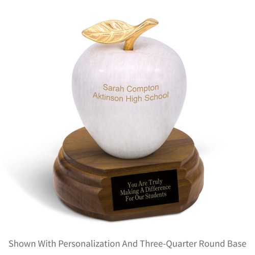 personalized white marble apple sitting on top a three-quarter round walnut base with black brass plate