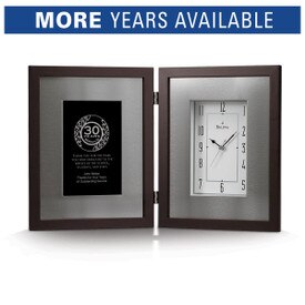 Bulova Large Framed Clock with brushed aluminum inner frame and espresso-brown solid wood outer frame. Displays years of service recognition on the left side.