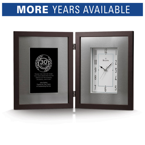 Bulova Large Framed Clock with brushed aluminum inner frame and espresso-brown solid wood outer frame. Displays years of service recognition on the left side.