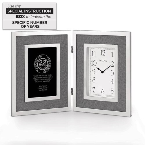 large silver framed clock award with 22 years of service message