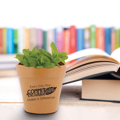 commit-mint flower pot sitting on a desk